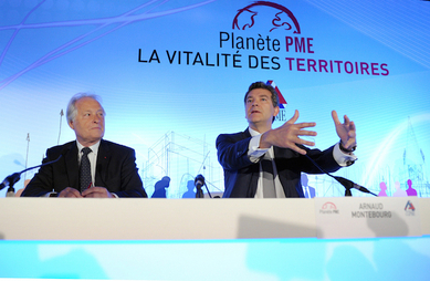 En juin 2014, l’ancien ministre de l’Économie Arnaud Montebourg et le président de la CGPME lors de la 12e édition de «Planète PME». (Eric Piermont/AFP/Getty Images)