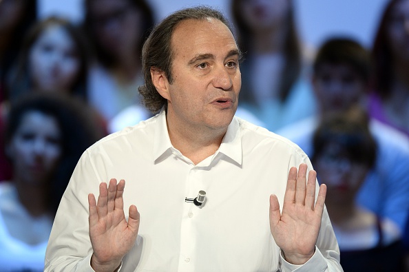 Xavier Niel, fondateur du groupe de télécom Iliad lors de l'enregistrement de l'émission « Le grand journal » sur Canal+, le 25 Juin 2015. (BERTRAND GUAY / AFP / Getty Images)