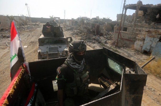 Des membres des forces spéciales irakiennes circulent dans Ramadi le 29 décembre 2015, après la reprise de la ville par le gouvernement. (Ahmad al-Rubaye/AFP/Getty Images)