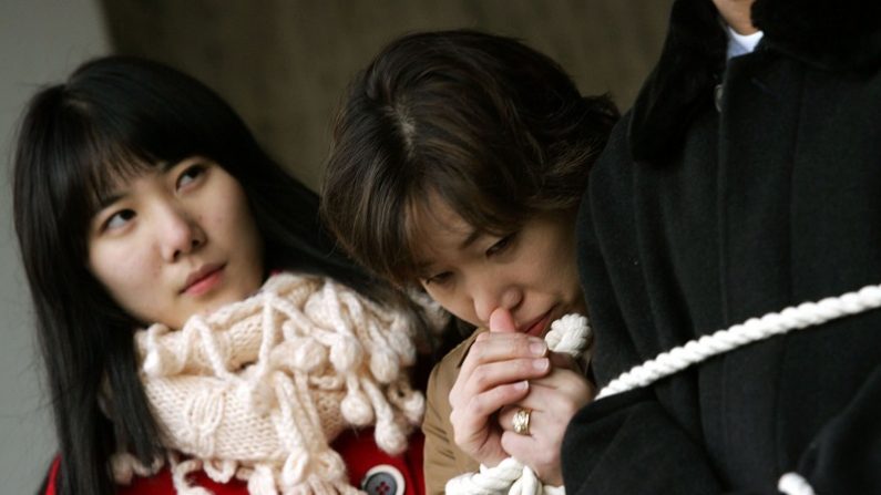 Image de défectrices de Corée du Nord en Corée du Sud protestant le bilan des droits de l'homme du Nord. Quelques 30 000 Nord-Coréens ont réussi à quitter le Nord et ont été relogés en Corée du Sud. (Chung Sung-Jun/Getty Images)

