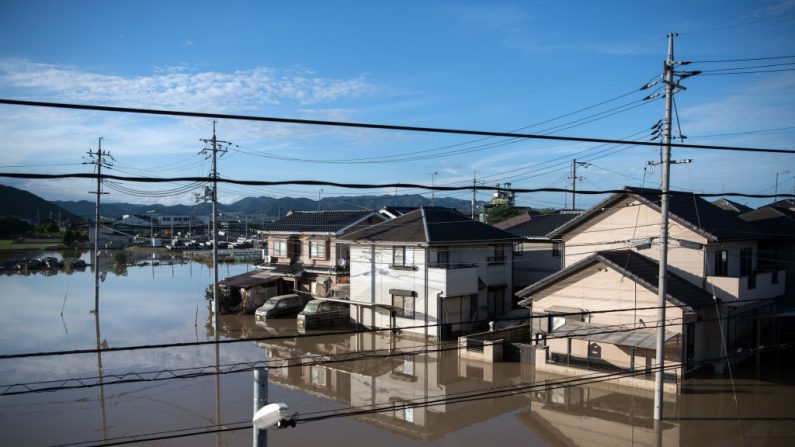 OKAYAMA, JAPAN - JULY 08: Houses sit partially submerged in floodwater on July 8, 2018 in Kurashiki near Okayama, Japan. Over 70 people have died and dozens are missing in Japan as torrential rain caused flash flooding and landslides across central and western parts of the country while more than two million people have been ordered to evacuate. (Photo by Carl Court/Getty Images)