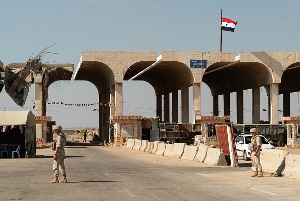 Le 14 août 2018, des membres de la police militaire russe patrouillent le poste frontalier de Nassib avec la Jordanie dans la province de Daraa a, dans le sud de la Syrie. Photo BORODULIN/AFP/Getty Images.