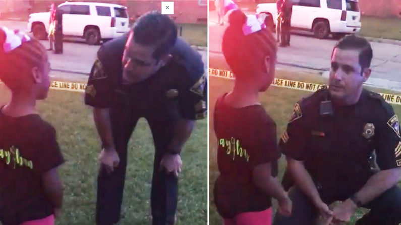 Un policier bien attentif aux paroles de cette enfant.