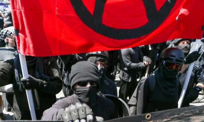 Antifa members and counter protesters gather during a rally at Martin Luther King Jr. Park in Berkeley, California on August 27, 2017. (Amy Osbourne/AFP/Getty Images)