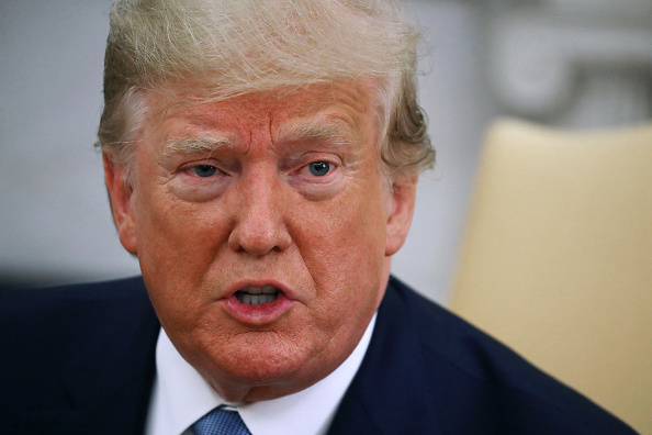 Le président américain Donald Trump s'adresse aux médias dans le bureau ovale à la Maison-Blanche le 22 juillet 2019 à Washington, DC. (Photo : Mark Wilson/Getty Images)