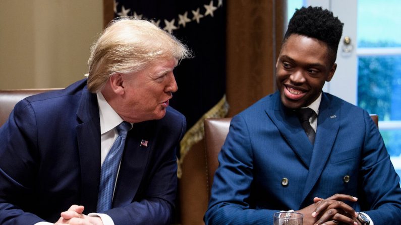 Walter Blanks 5R) listens as US President Donald Trump participates in a roundtable on empowering families with education choice at the White House on December 9, 2019 in Washington,DC. (Photo by Brendan Smialowski / AFP) (Photo by BRENDAN SMIALOWSKI/AFP via Getty Images)