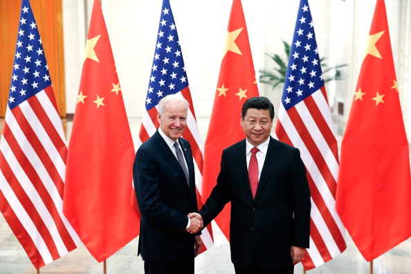 BEIJING, CHINA - DECEMBER 04:  Chinese President Xi Jinping (R) shake hands with   U.S Vice President Joe Biden (L) inside the Great Hall of the People on December 4, 2013 in Beijing, China. U.S Vice President Joe Biden will pay an official visit to China from December 4 to 5.  (Photo by Lintao Zhang/Getty Images)