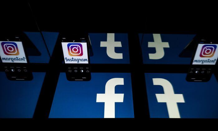 Des logos des réseaux sociaux Facebook et Instagram sur les écrans d'une tablette et d'un téléphone portable. (Lionel Bonaventure/AFP via Getty Images)