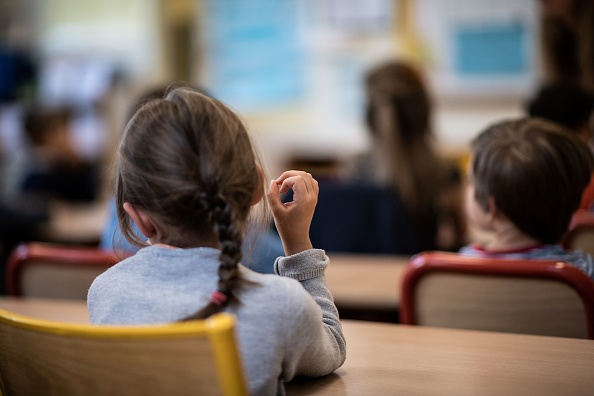  Pas de pass sanitaire dans les établissements scolaires à la rentrée.   (Photo : MARTIN BUREAU/AFP via Getty Images)