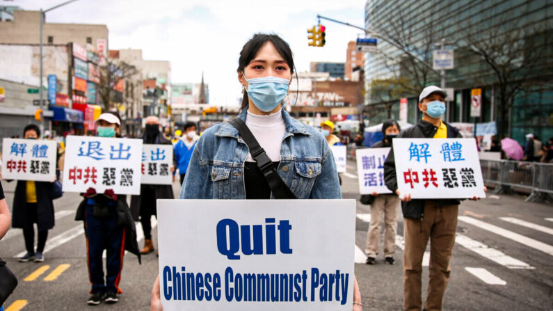 Falun Gong practitioners take part in a parade in Flushing, New York, on April 18, 2021, to commemorate the 22nd anniversary of the April 25th peaceful appeal of 10,000 Falun Gong practitioners in Beijing. (Samira Bouaou/The Epoch Times)