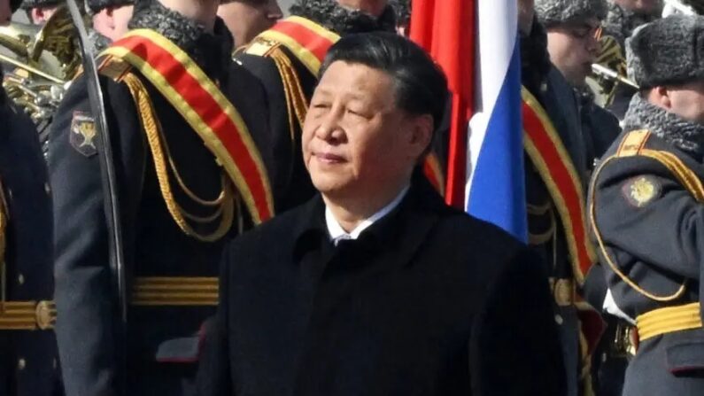 Chinese leader Xi Jinping walks past honor guards during a welcoming ceremony at Moscow's Vnukovo airport on March 20, 2023. (Anatoliy Zhdanov/Kommersant Photo/AFP via Getty Images)