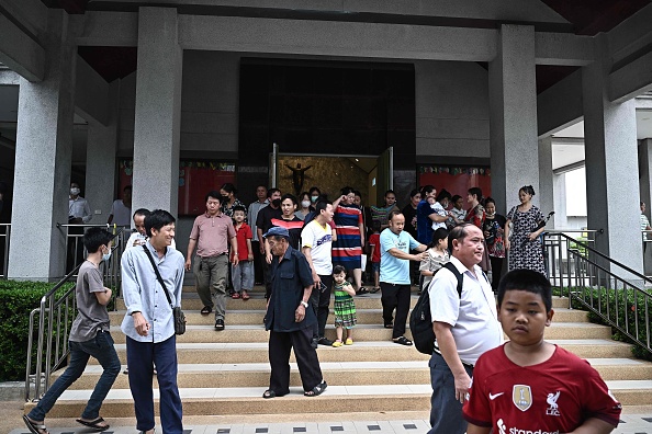 Des membres de la communauté vietnamienne Hmong vivant en Thaïlande, dont beaucoup sont des demandeurs d'asile. (Photo LILLIAN SUWANRUMPHA/AFP via Getty Images)