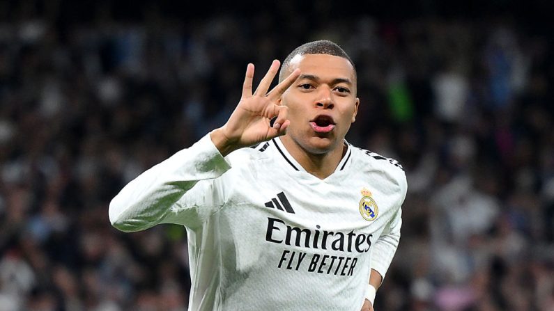 Auteur d'un triplé qui a qualifié son équipe mercredi pour les huitièmes de finales de la Ligue des champions, Mnbappé affirme qu'il était venu en Espagne "pour marquer son époque". (Photo : David Ramos/Getty Images)